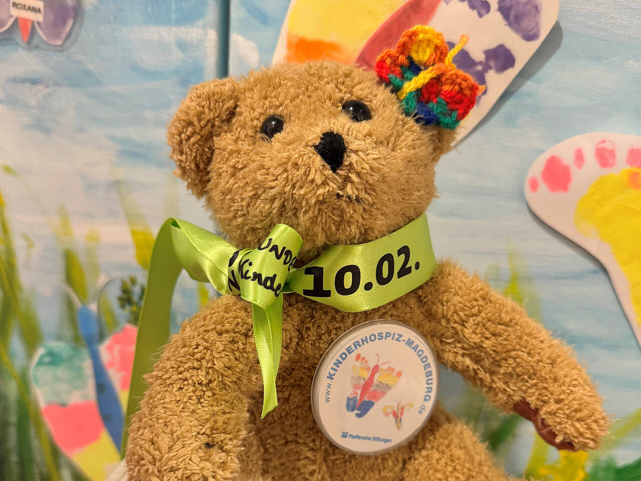 Teddy mit grünem Band